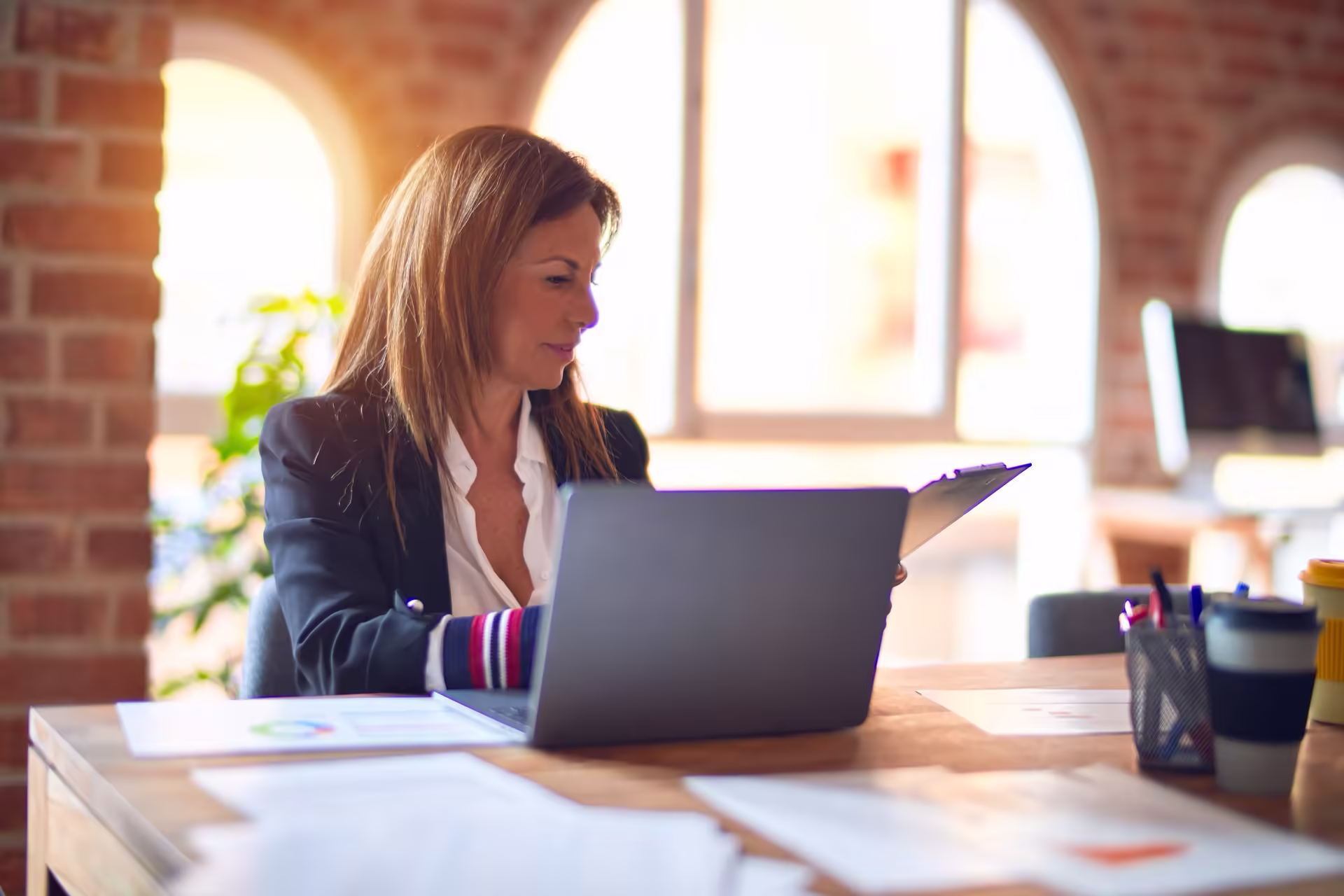 Manager reviewing training costs on a laptop
