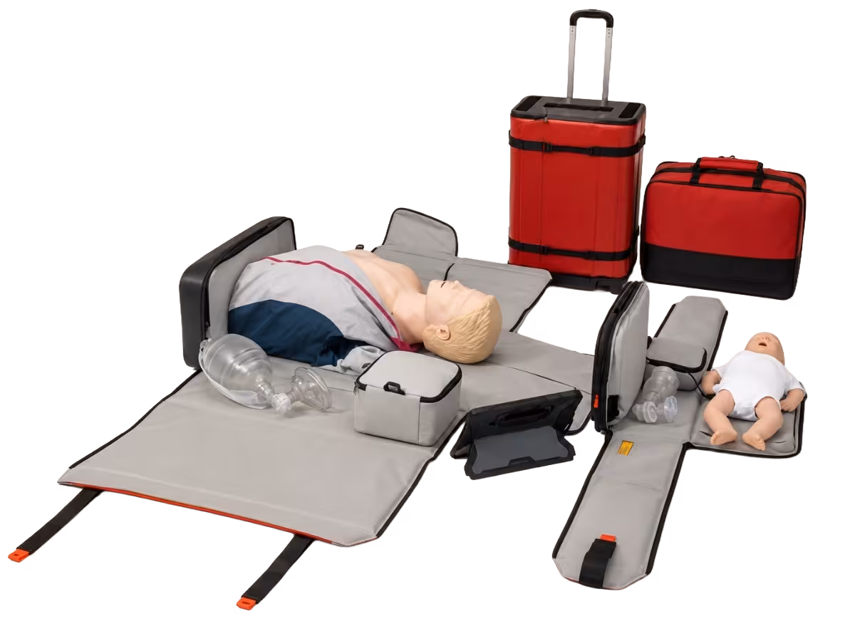 CPR Go-Kit opened into a full skills station with adult and infant manikins, masks and a feedback tablet